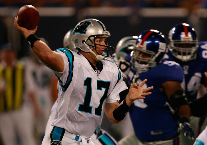 Jake Delhomme attempts a pass against the Giants.
